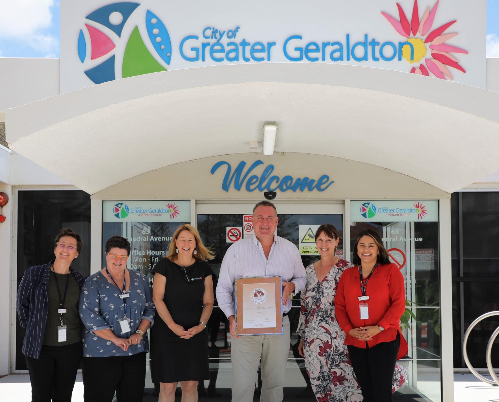 City of Greater Geraldton Mayor Shane Van Styn pictured with City staff Communications Officer – Digital Nicole Roberts, Communications Officer – Design Keely Grieve, Manager Libraries, Heritage and Gallery Trudi Cornish, Manager Strategic Planning and Economic Development Trish Palmonari and A/Coordinator Communications Tully Gray celebrating the win. 